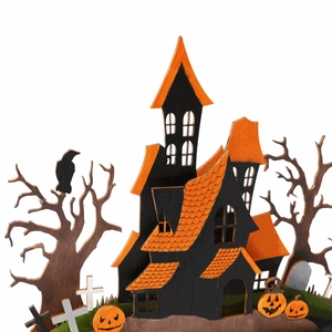 Detail view of layered wooden Halloween house with pumpkins and crows on a white background