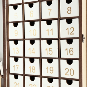 Detail of wooden advent calendar featuring 24 white drawers with golden numbers