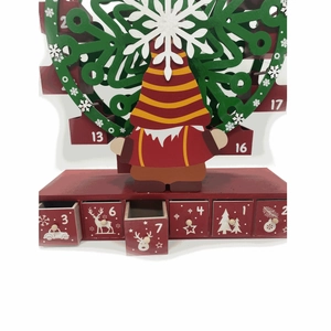 Detail of wooden Christmas ferris wheel advent calendar with gnome and drawers