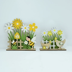 Detail of laser-cut wooden Easter garden ornaments with floral and animal motifs