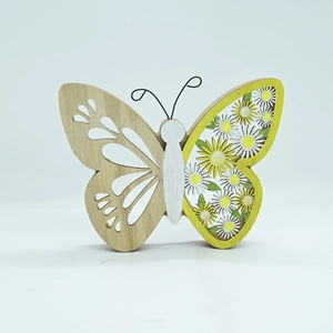 Close-up of butterfly wooden desktop decor with yellow floral daisy pattern and cutouts