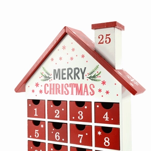 Macro view of wooden Christmas advent calendar with numbered drawers and house shape