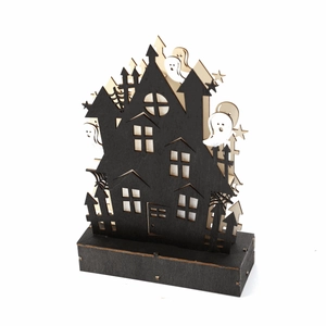 Detail of wooden Halloween haunted house with ghost silhouettes and warm LED light base
