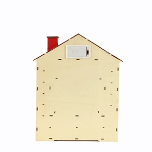 Detail view of the wooden advent calendar back with AA battery compartment and switch