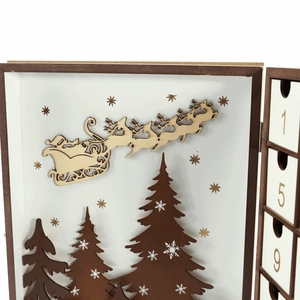 Macro detail of laser-cut wooden Christmas advent calendar box with countdown drawers