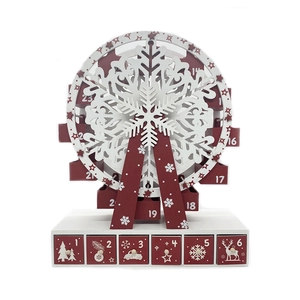 Close-up of wooden Ferris wheel advent calendar featuring 24 numbered red and white drawers