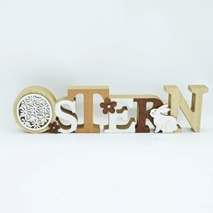 Detailed view of OSTERN wooden Easter ornaments with rabbit and floral cutouts