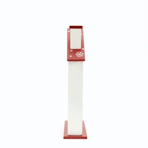 Close-up of a wooden Christmas countdown calendar with a red roof and snowflake patterns