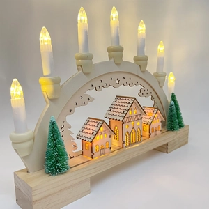 Macro detail of wooden LED Christmas arch with warm village scene and seven candles