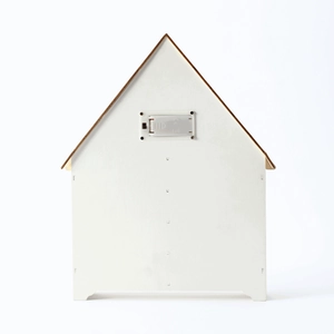 Detail view of the back battery compartment and power switch of a white wooden house calendar