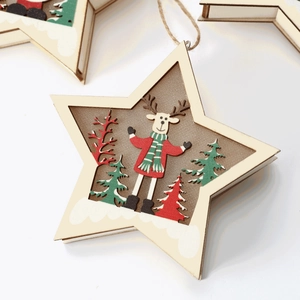 Star-shaped wooden Christmas ornament with reindeer, pine tree and hanging rope details