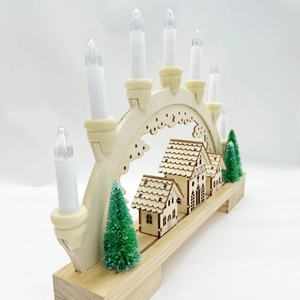 Detail of wooden Christmas bridge lamp with 7 candles and winter village scenery
