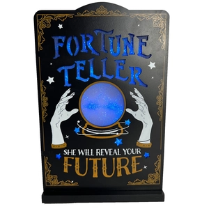 Close-up of wooden Fortune Teller LED sign with crystal ball illustration for Halloween