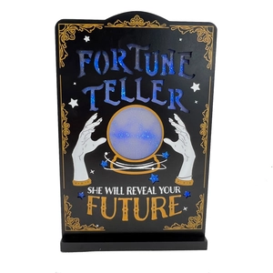 Detail of LED wooden Fortune Teller plaque with golden graphics and blue glitter