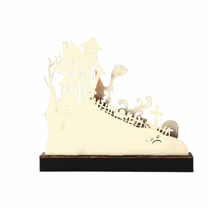 Detail view of laser-cut wooden Halloween silhouette with haunted house on black base