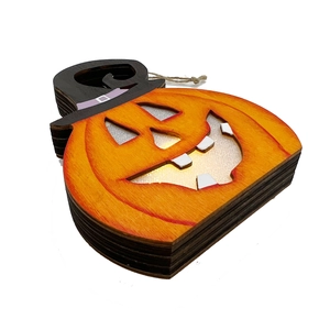 Detail of layered wooden Halloween pumpkin light with witch hat and hanging rope