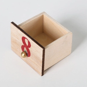 Wooden advent calendar drawer with red number 8 and golden handle on white background
