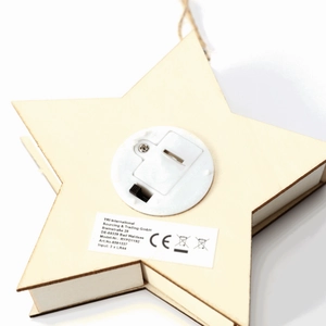 Back view of star-shaped wooden LED Christmas ornament with battery compartment