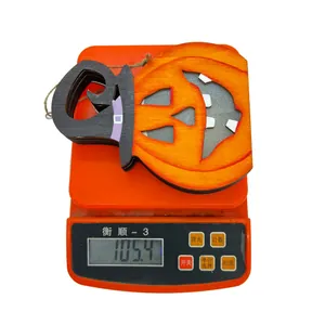 Weight measurement of wooden Halloween pumpkin hanging ornaments showing 105.4g on scale