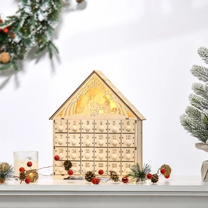 Detail of wooden Advent calendar with 24 drawers and LED Nativity scene silhouette