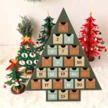 Detail of wooden Christmas tree advent calendar with 24 numbered green drawers