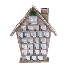 Detailed view of the wooden advent calendar house with 25 countdown drawers and pine decor