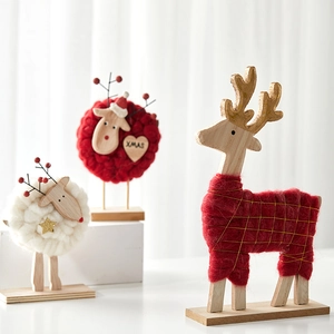 Handmade wool felt reindeer and Xmas tree wooden desktop decorations in Nordic style