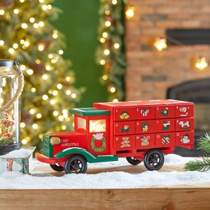 Wooden Christmas bus advent calendar with 12 numbered drawers for holiday countdown