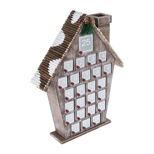 Detail of wooden advent calendar with 25 small drawers and snowy pinecone decorations