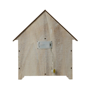 Rear view of wooden advent calendar showing battery compartment and manual power switch cord