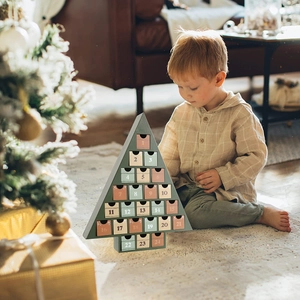 Christmas tree shaped wooden advent calendar with 24 colorful numbered drawers for decor
