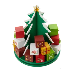 Top view of wooden Christmas tree advent calendar with 24 colorful numbered drawers