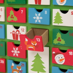 Wooden Christmas advent calendar with colorful numbered drawers and festive holiday patterns