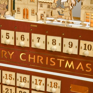 Detail of wooden Christmas advent calendar with LED lights and festive miniature scene