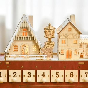 Detailed view of wooden Christmas bus calendar with LED lights and miniature scenery
