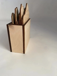 Miniature wooden landscape calendar stand with minimalist mountain peaks and rustic base