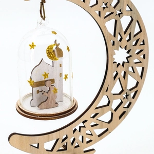 Detailed laser-cut wooden moon stand with glass bell jar and mosque silhouette inside