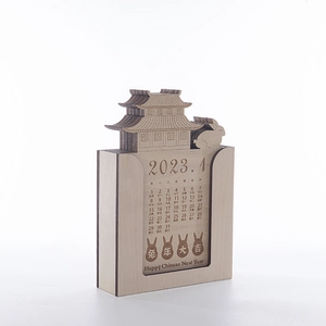 Close-up of laser-cut wooden perpetual calendar with Chinese palace and rabbit design