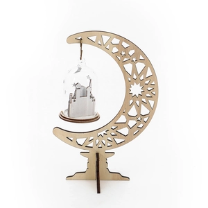 Detail of wooden crescent moon ornament with glass globe and mosque silhouette decoration