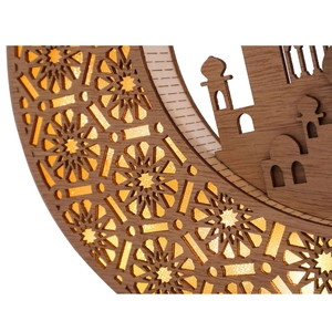 Detailed close-up of wooden Ramadan crescent moon lamp with warm LED cutout patterns