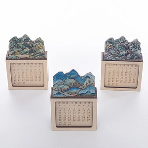 Detail of wooden 3D landscape desk calendar with traditional Chinese painting and base
