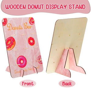 Detail of wooden donut bar stand with pink marble print and nine display pegs