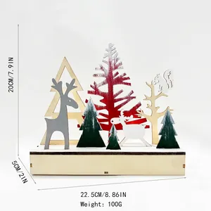 Handcrafted Nordic wooden Christmas reindeer tabletop ornament with forest silhouette layers