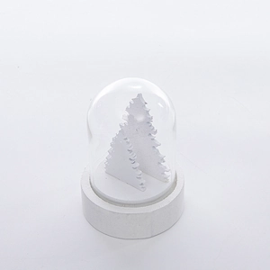 Minimalist white Christmas glass dome decoration with a wooden tree inside on white base