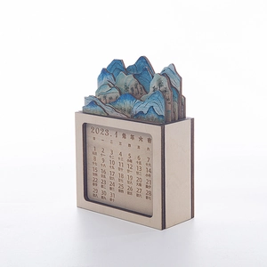 Detailed view of 3D laser-cut wooden calendar featuring Chinese landscape scenery art