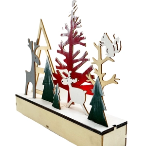 Handcrafted Nordic wooden Christmas reindeer tabletop ornament with red tree and animal silhouettes