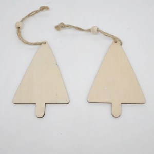 Detail of wooden Christmas tree ornaments with natural jute twine and small wooden beads