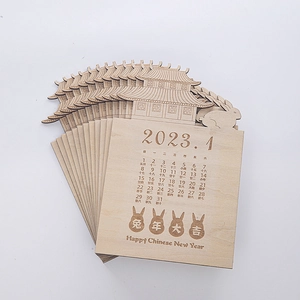 Detail of wooden 2023 calendar featuring Chinese rabbit zodiac and palace laser cutouts