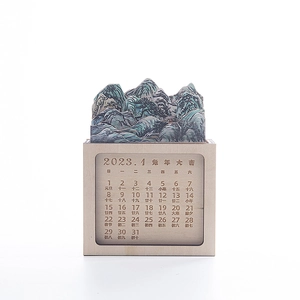 Macro detail of the 3D layered wooden landscape calendar featuring January 2023 panel