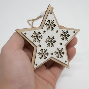 Handheld rustic wooden star ornament with snowflake cutout and white glitter finish